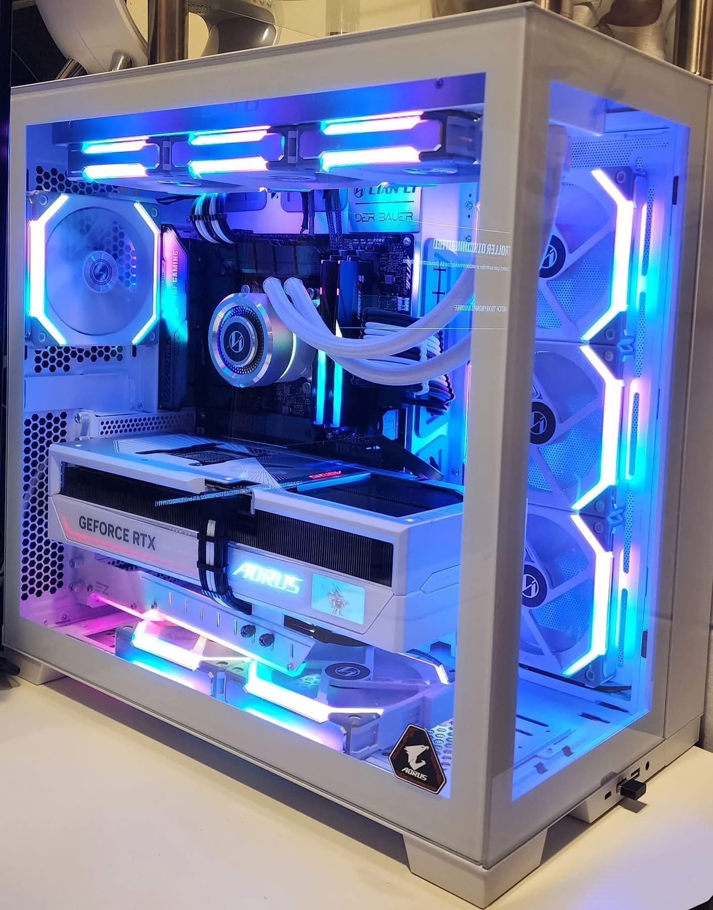 All-white custom PC with blue RGB lighting and AORUS GeForce RTX